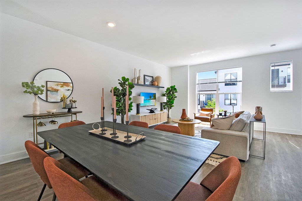 a living room with a table and chairs and a couch