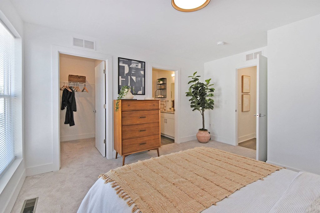 a bedroom with a bed and a closet