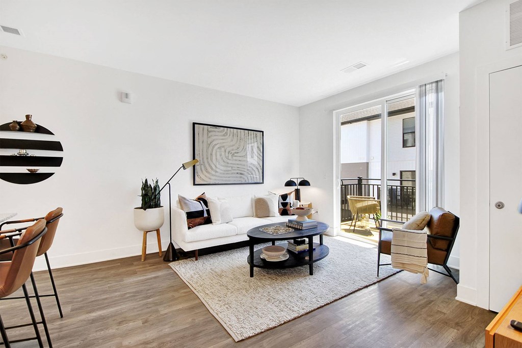 an open living room with a couch and a table