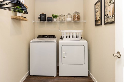 A laundry room with a washer and dryer.