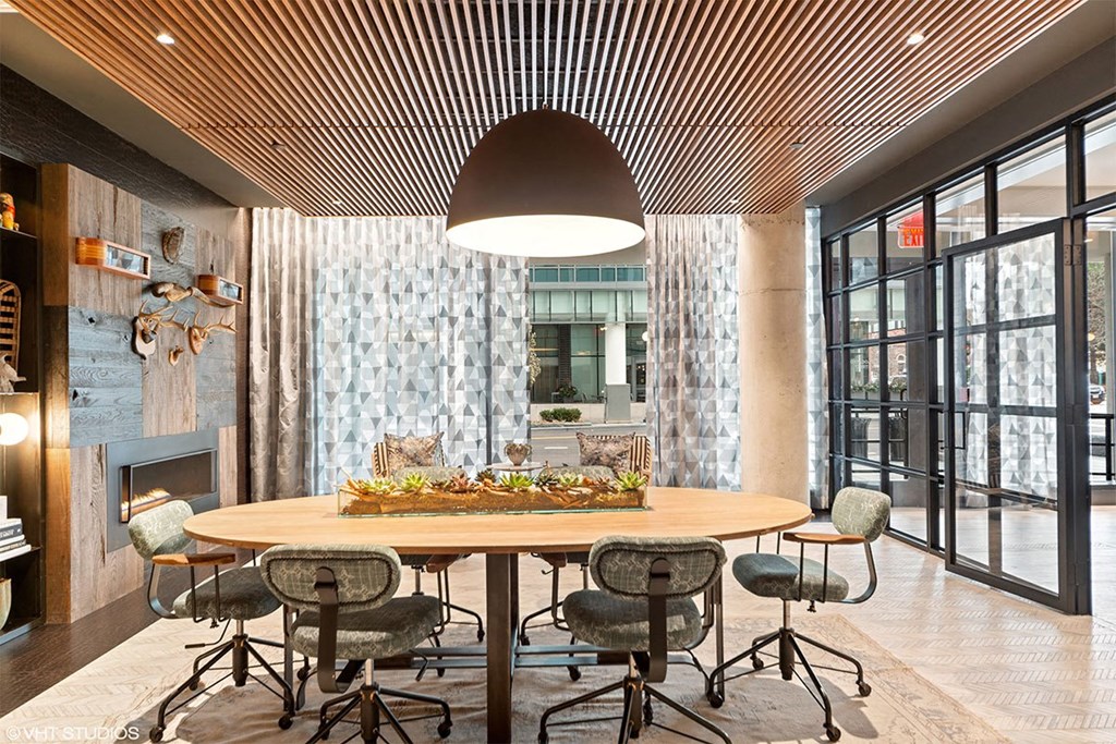 a dining room with a table and chairs and a fireplace