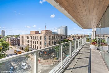a view of the city from the balcony of a building