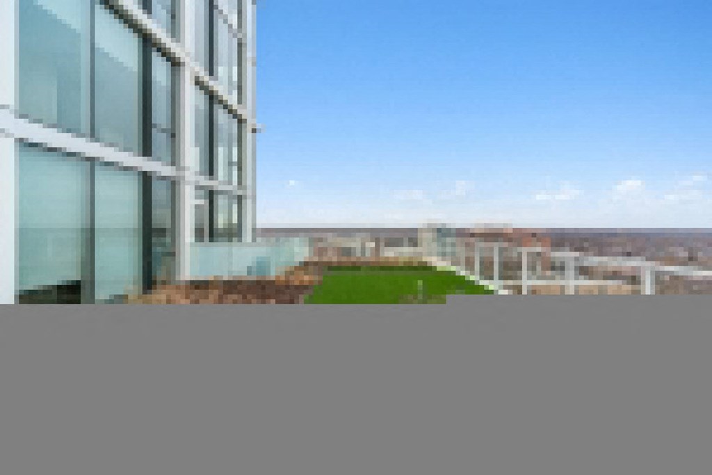 a green space on the balcony of an office building