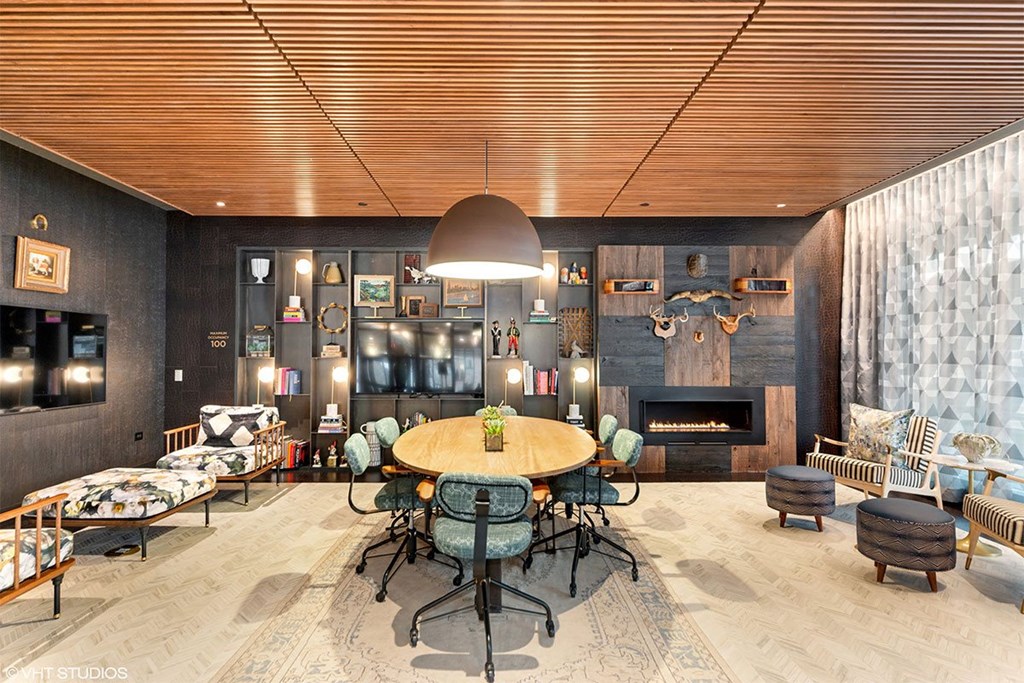 a dining room with a table and chairs and a fireplace