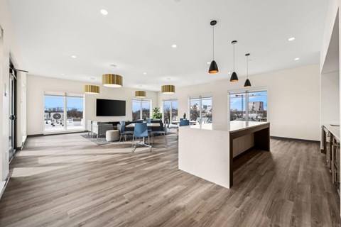 A spacious office with a long table and chairs.