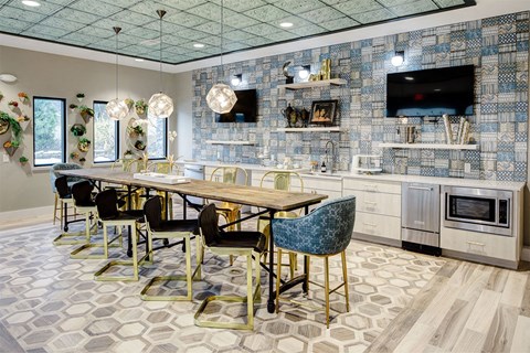 a dining room with a table and chairs and a television