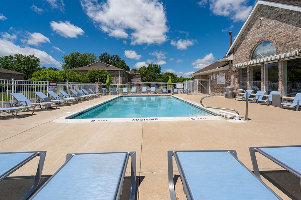outdoor pool with lounge chairs