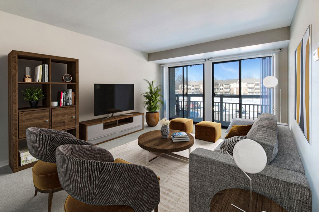 A living room with a grey couch, a coffee table, and a television.