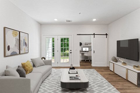 A modern living room with a grey sofa and a coffee table.