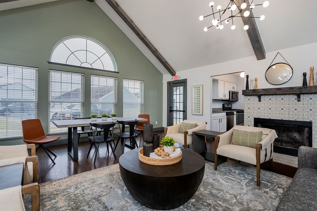 apartment club house lounge with large windows and kitchen