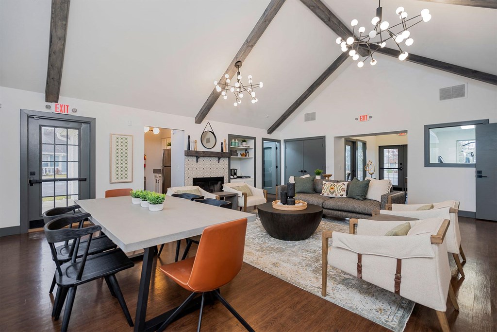 apartment club house lounge with long table and lounge seating