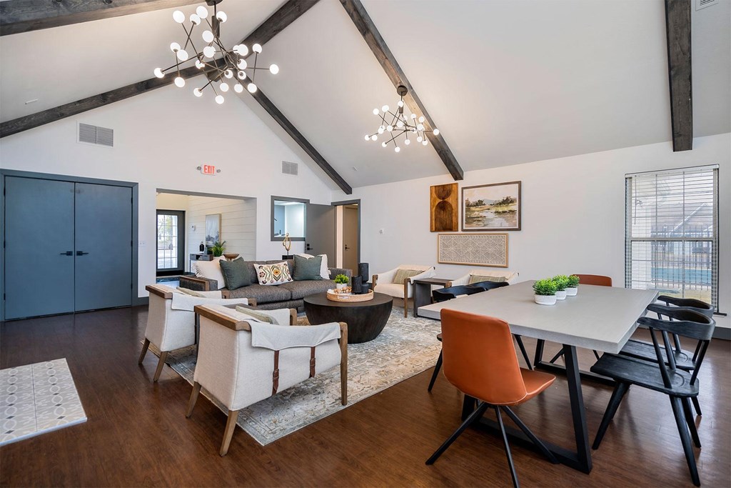 apartment resident club house lounge with sofa chairs and long table