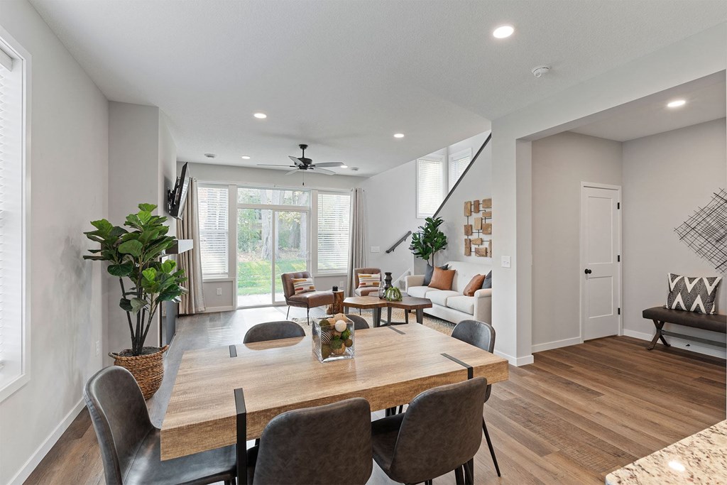 a living room with a table and chairs and a couch