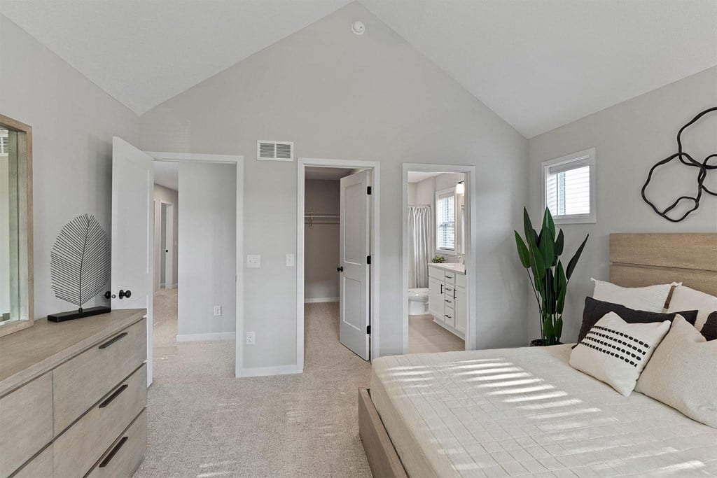 a bedroom with a large bed and a closet