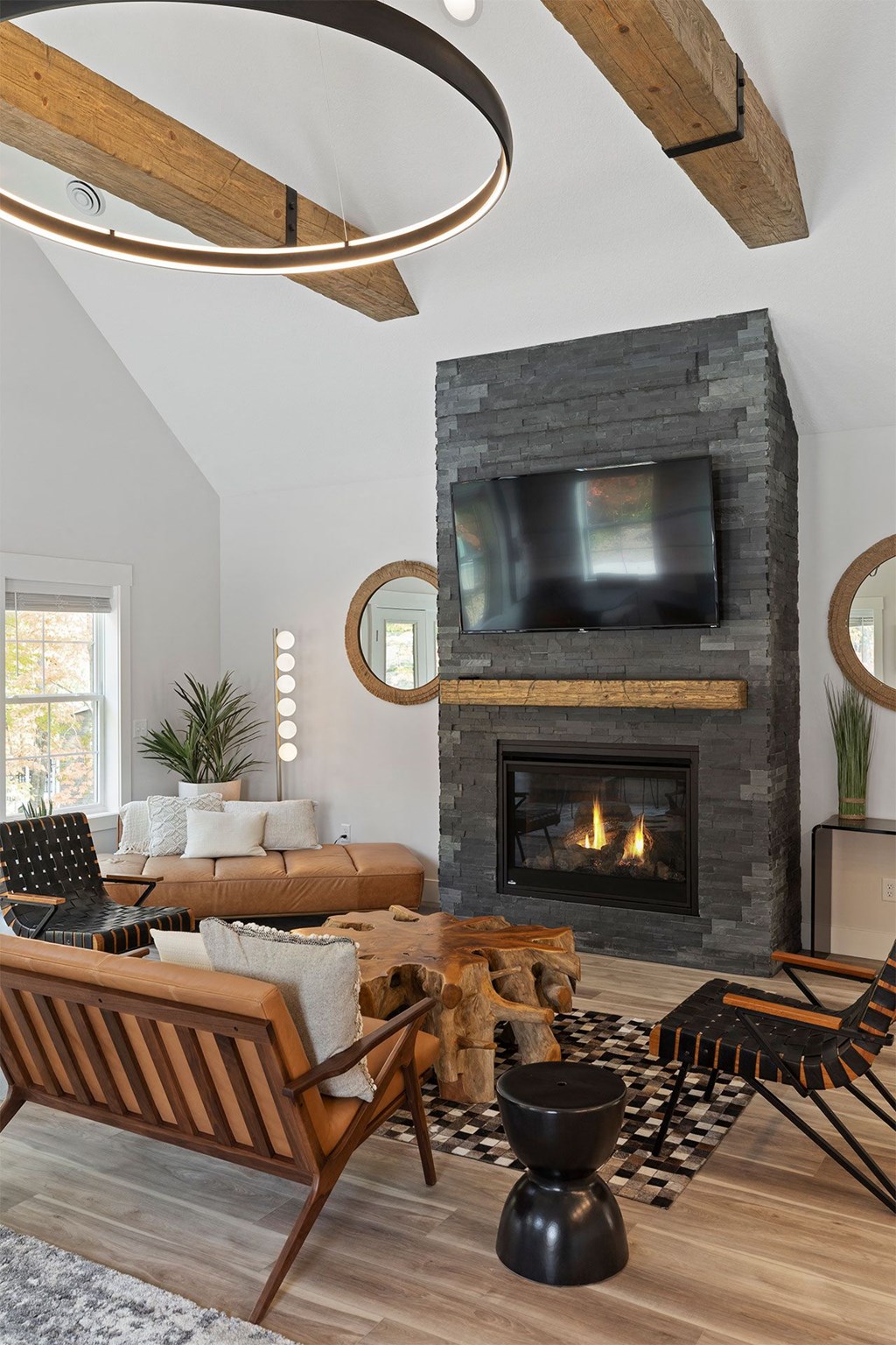 a living room with a fireplace and a tv above it