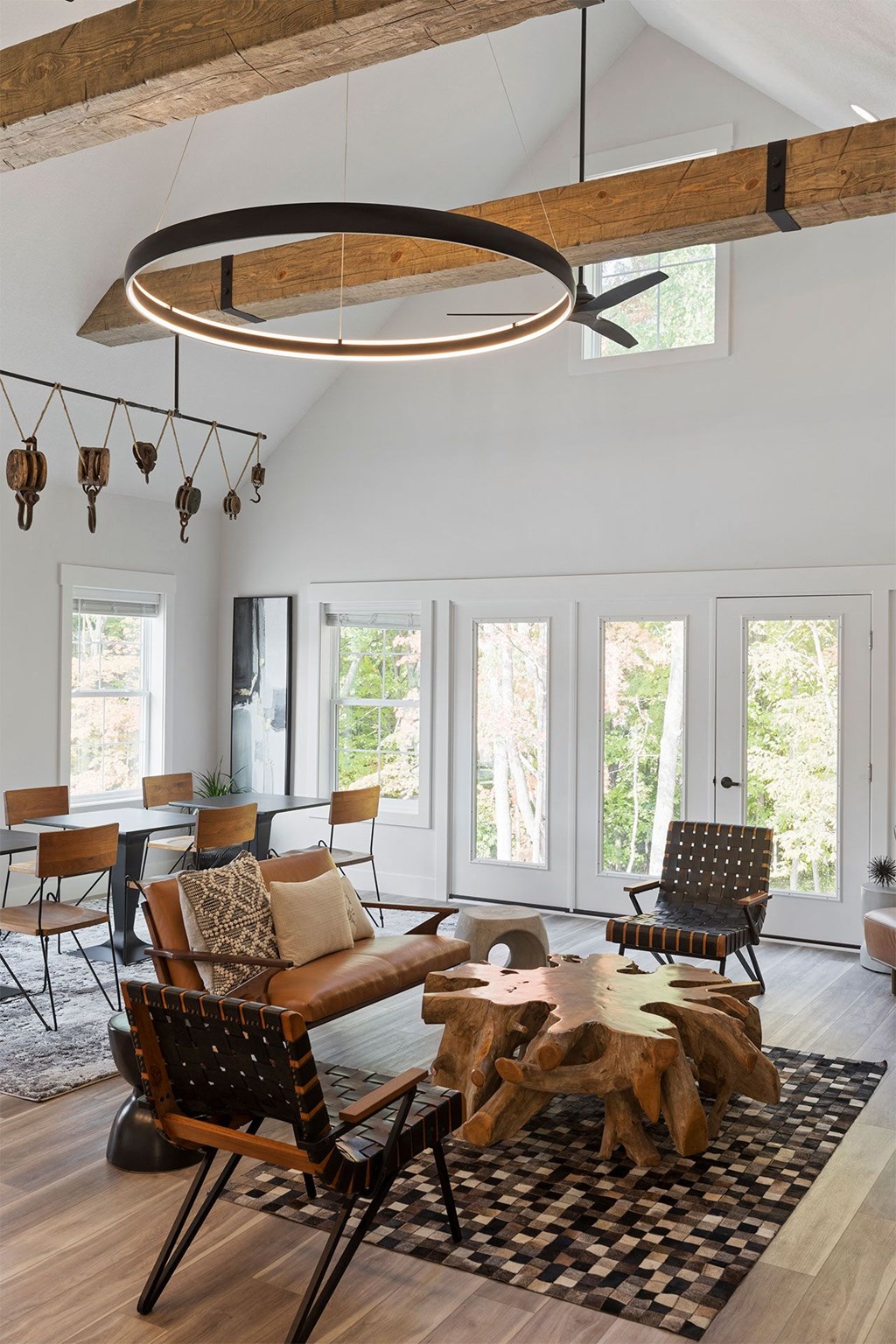 a living room with a couch and chairs and a table
