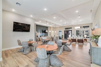 boterra at lago mar apartments clubhouse with tables and kitchen