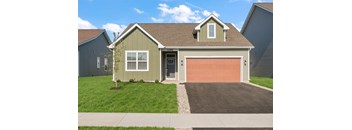 A house with a brown garage door and a grey roof.
