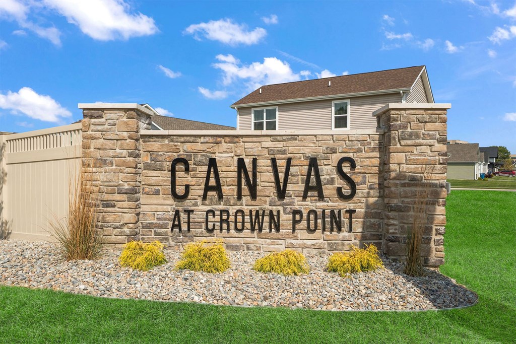 A stone wall with the words