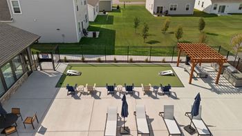 A sunny day at the park with people enjoying the outdoors.