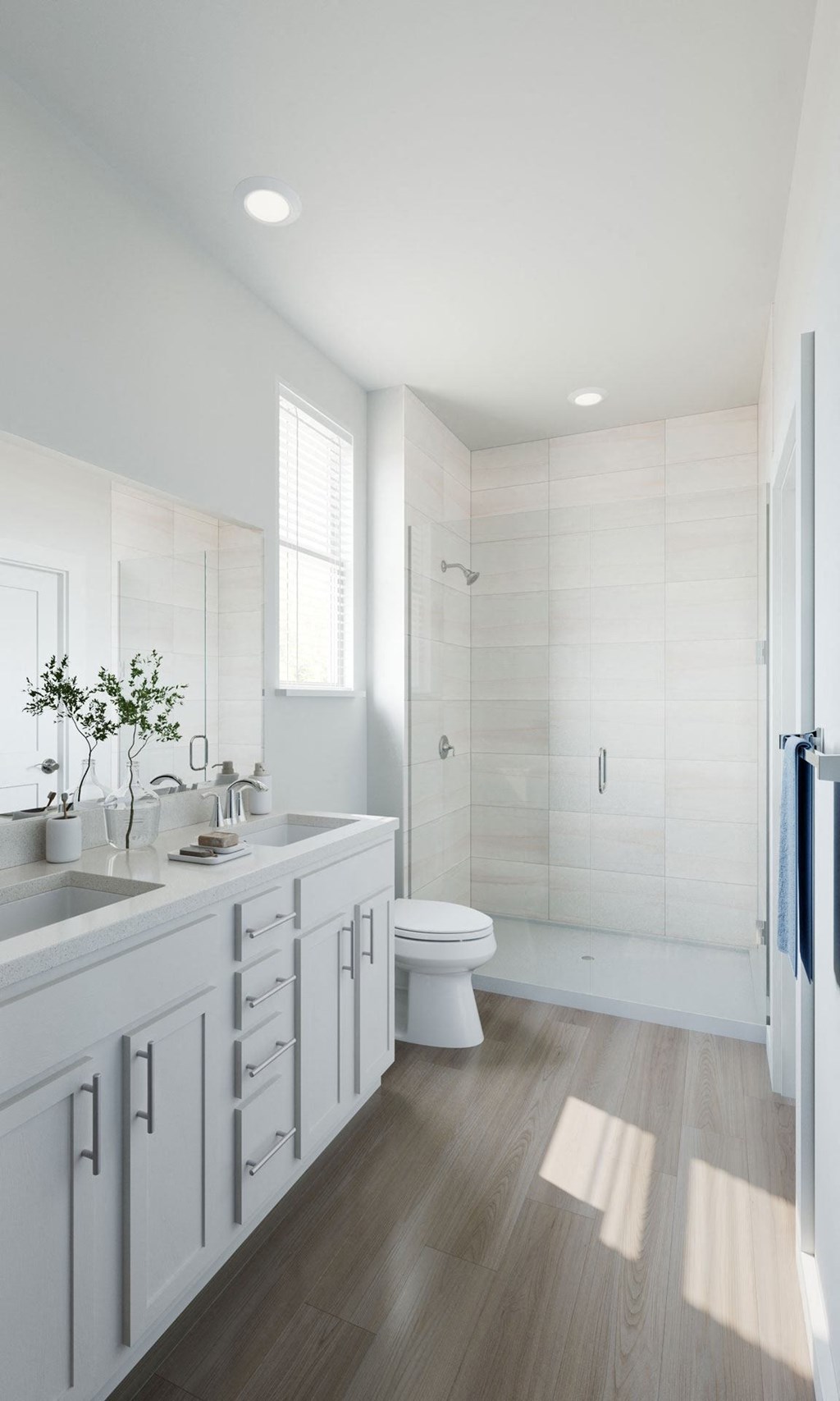 a white bathroom with a toilet and a sink