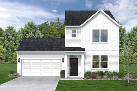 a white house with a black roof and a driveway