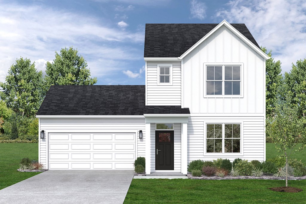 a white house with a black roof and a driveway