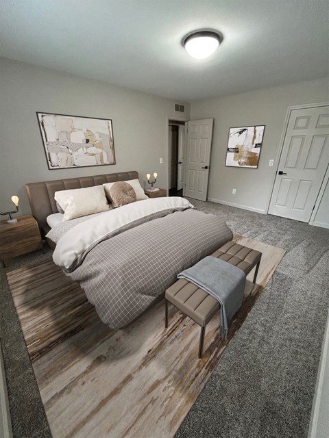 A bedroom with a bed, nightstands, and two doors.