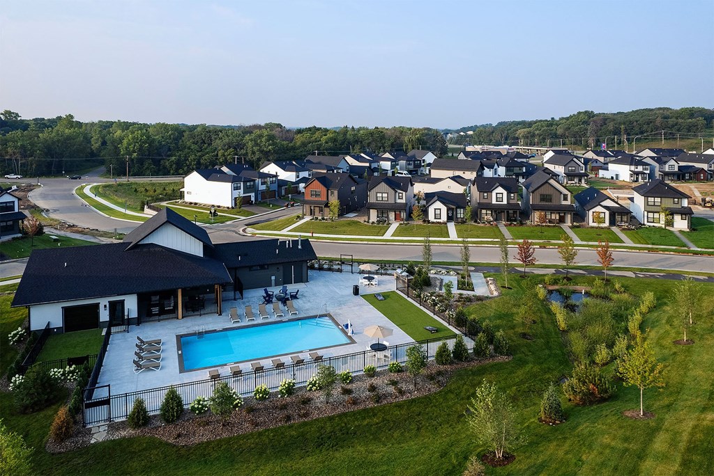 an aerial view a rental home community and an outdoor pool