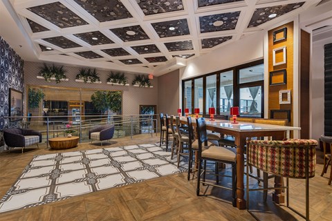 A dining room with a wooden table and chairs.
