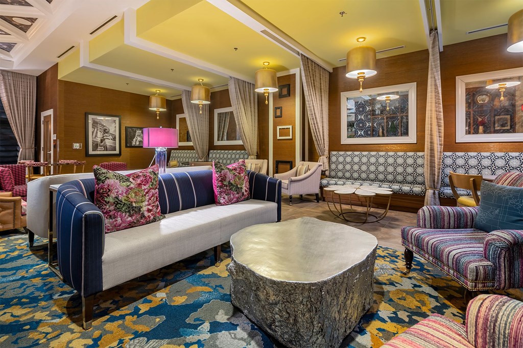 A living room with a sofa, chairs, and a coffee table.