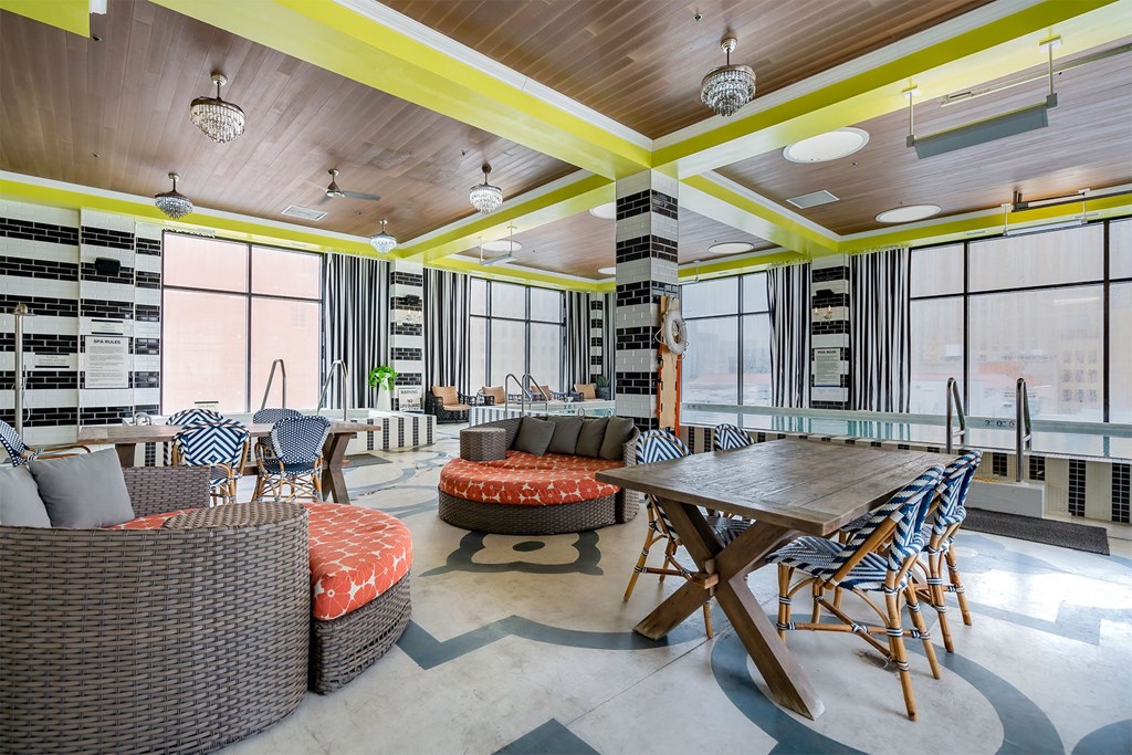 A sunny day at the patio with a table and chairs.