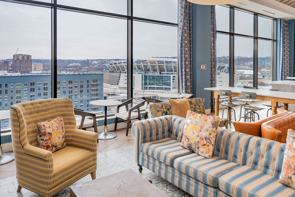 A living room with a view of a stadium.