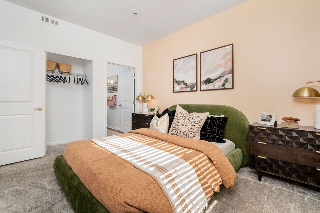 a bedroom with a bed and a closet