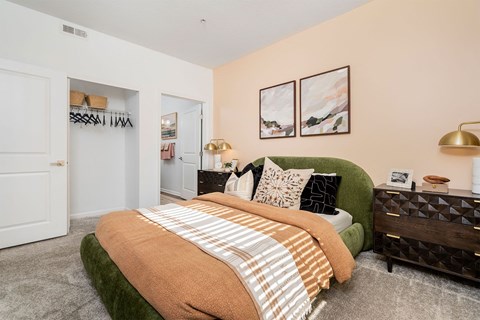 a bedroom with a bed and a closet