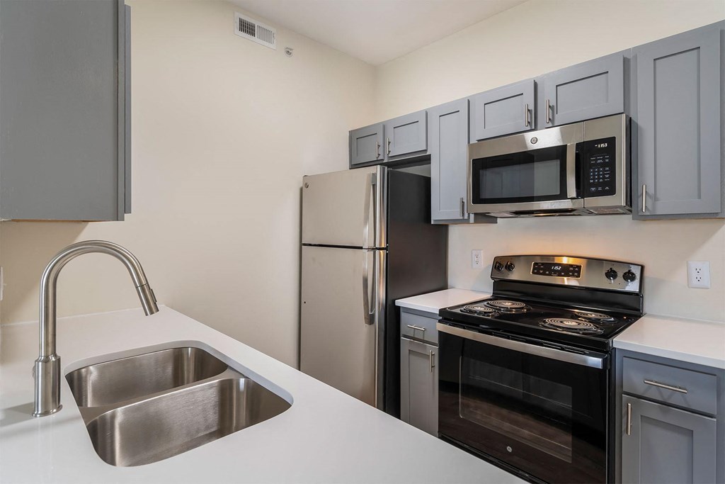 a kitchen with stainless steel appliances and a sink