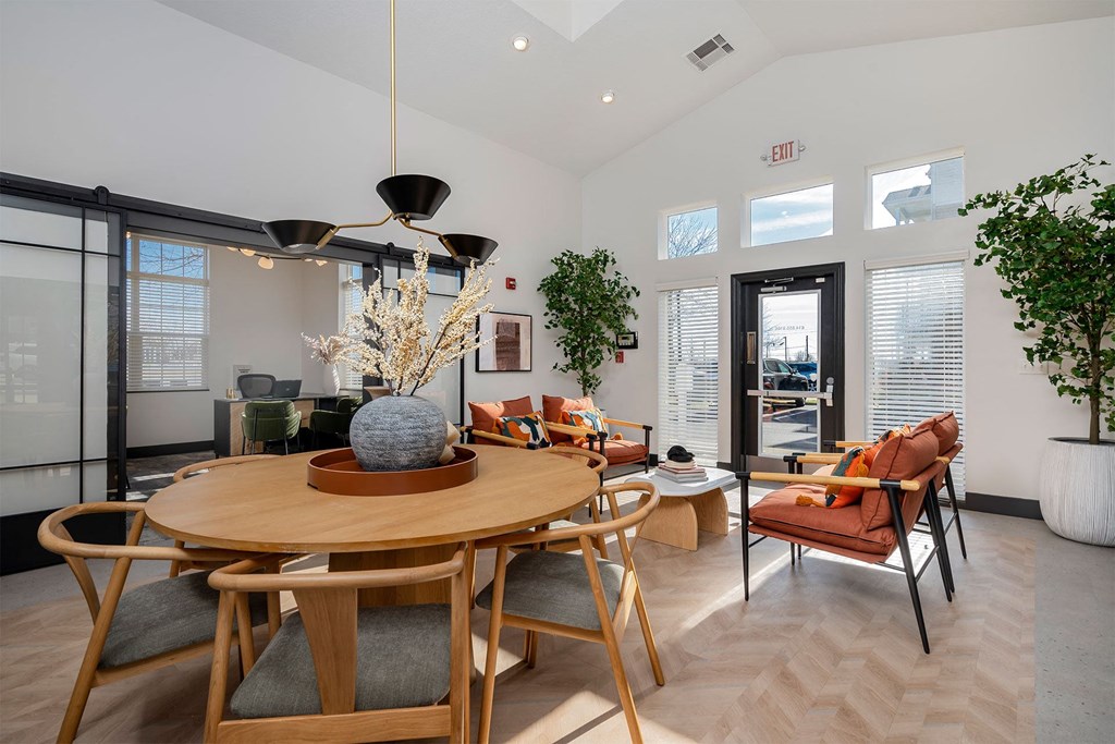 a dining room with a table and chairs