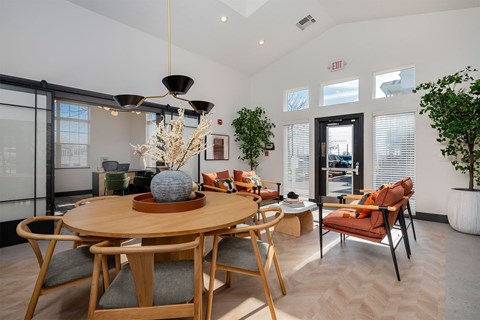a dining room with a table and chairs