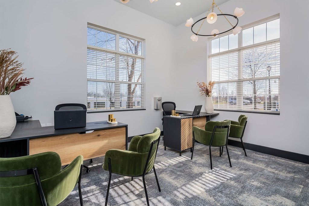 a conference room with chairs and desks and two windows