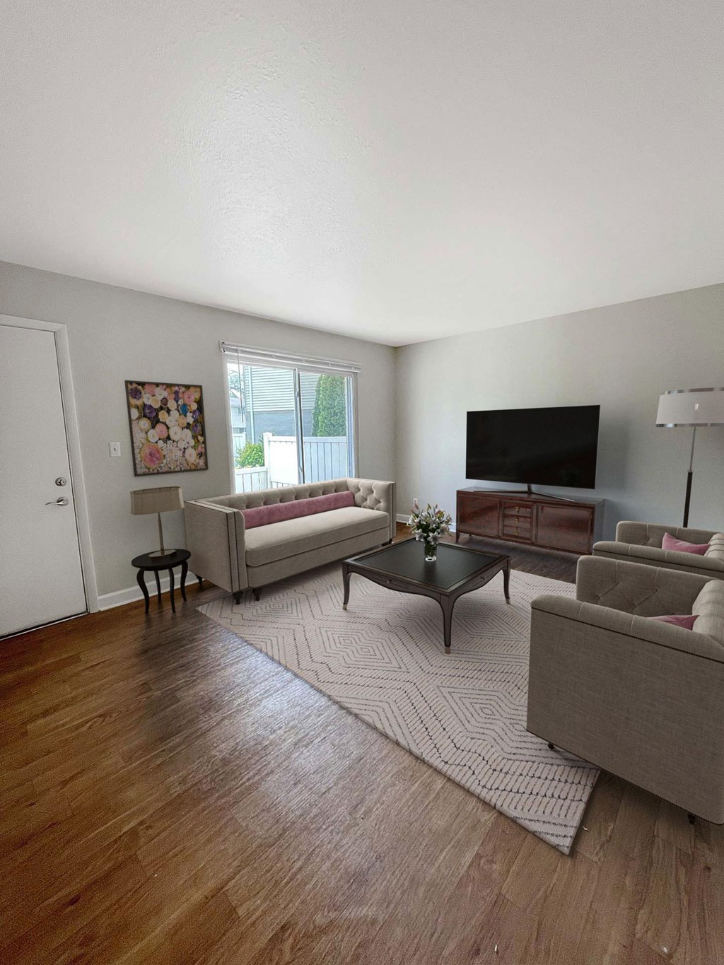 A living room with a couch, chair, and coffee table.