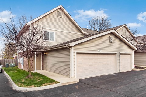 A two-car garage is attached to a house.
