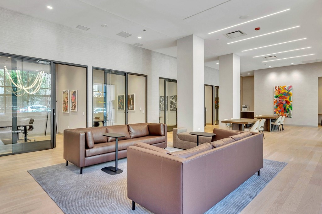 a room with couches and tables in a lobby