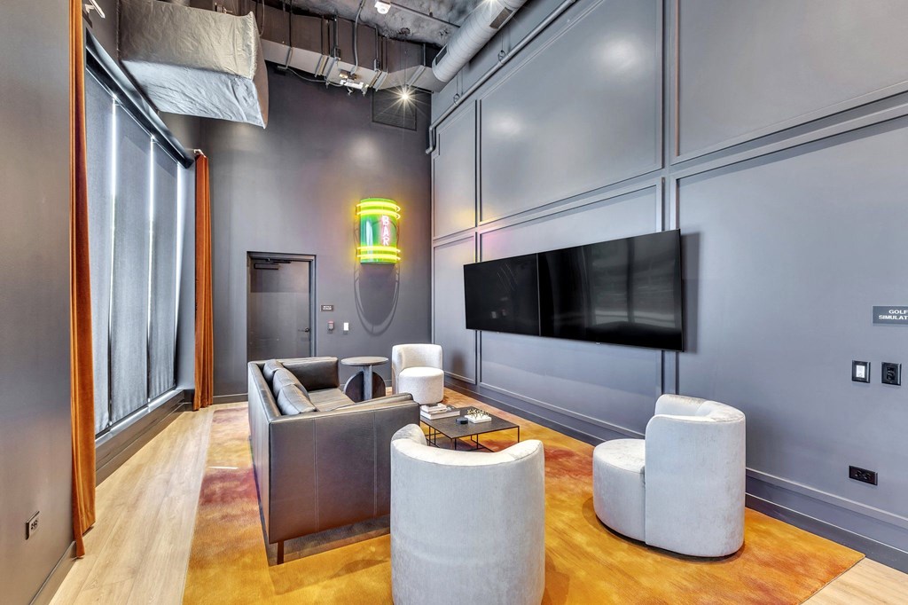 a living room with a couch and a tv