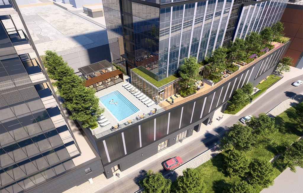 an aerial view of a building with a swimming pool