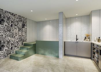 a large bathroom with a sink and a staircase