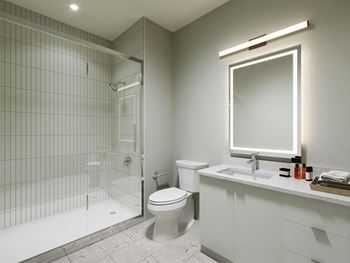 a bathroom with a toilet sink and shower