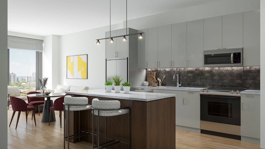 a kitchen and dining room with a table and chairs