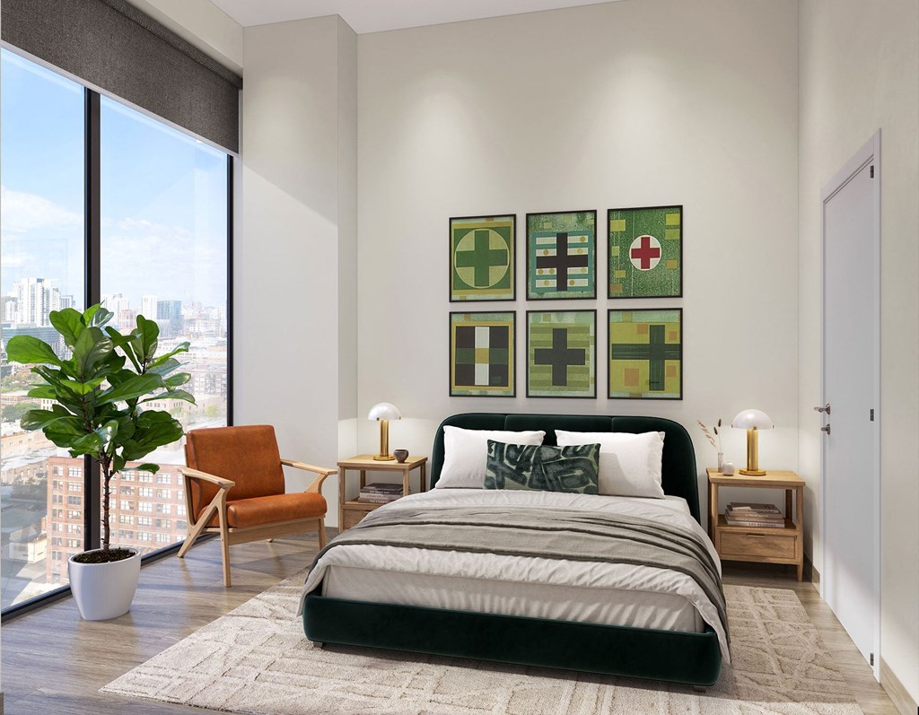 a bedroom with a bed and a large window