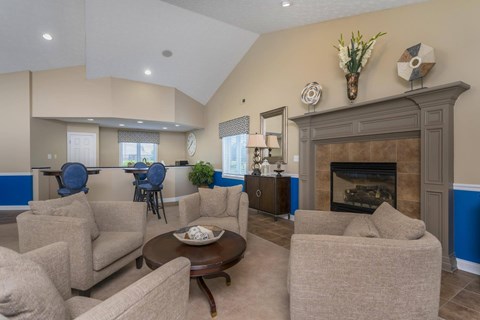 A living room with a fireplace and a couch.