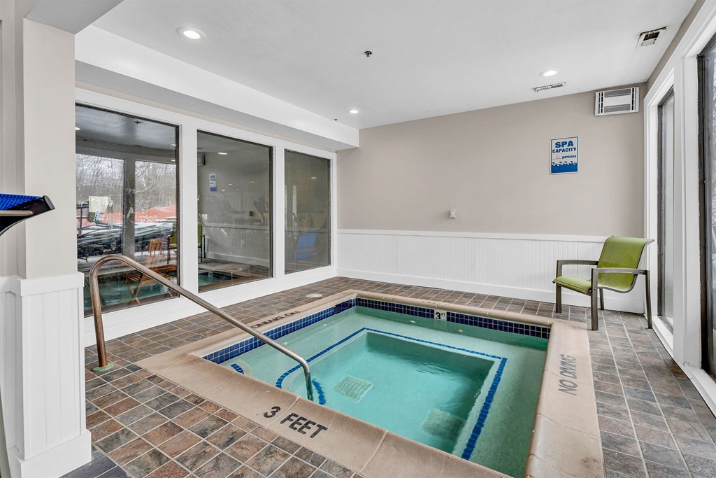 A small indoor pool with a 3 feet depth marker.